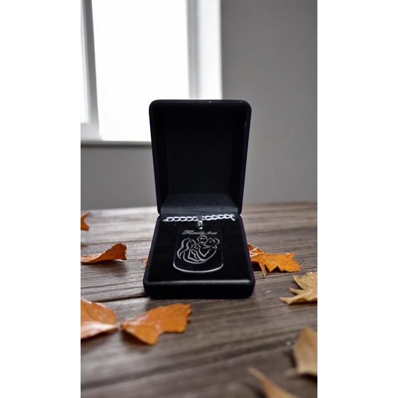 Laser-engraved inox pendant with “Family First” and family outline. Symbolic gift with chain and gift box. FAM"Stainless steel pendant with engraved words 'Family First'"