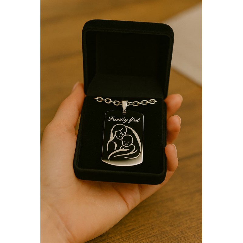 Engraved metal pendant “Family First” with mother and child design