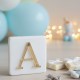 Marble element with gold plexyglass with the initial letter of the name Marble favor box with monogram on plexiglass
